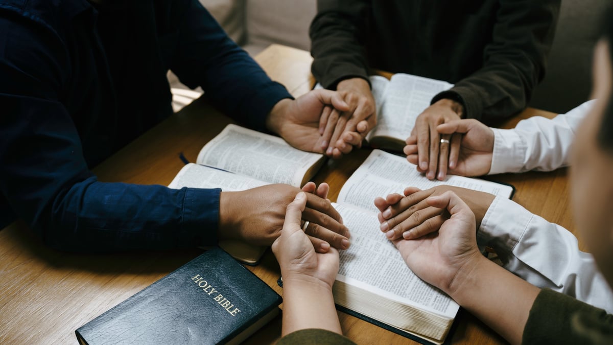 Christian family praying together